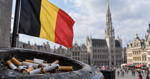 Belgian customs evidence table with unbranded cigarette packs and official paperwork.