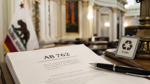 AB 762 legislation on a desk inside the California State Capitol