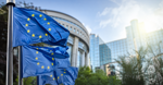 European Union and Swedish flags outside an EU government building in Brussels
