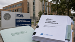 FDA headquarters with regulatory documents referencing the JUUL2 authorization